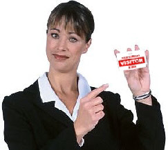 businesswoman holding a visitor badge